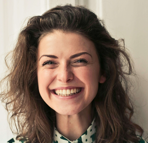 A smiling woman with brown hair